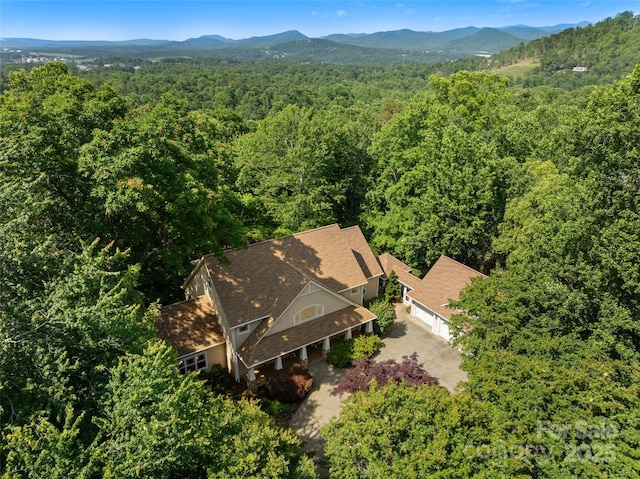303 S Braeside Ct, Asheville, NC 28803 - view from above of property featuring a heavily wooded area and a mountain backdrop