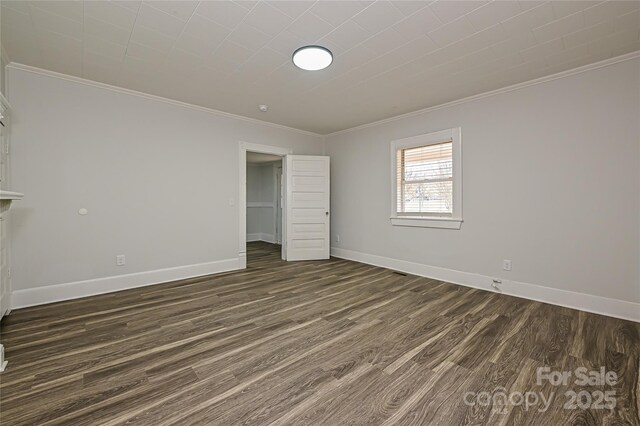 613 E Liberty St, Salisbury, NC 28144 - unfurnished bedroom featuring ornamental molding and dark wood-style flooring