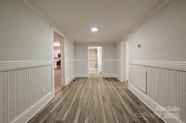 613 E Liberty St, Salisbury, NC 28144 - hallway with wainscoting, dark wood-type flooring, ornamental molding, and recessed lighting