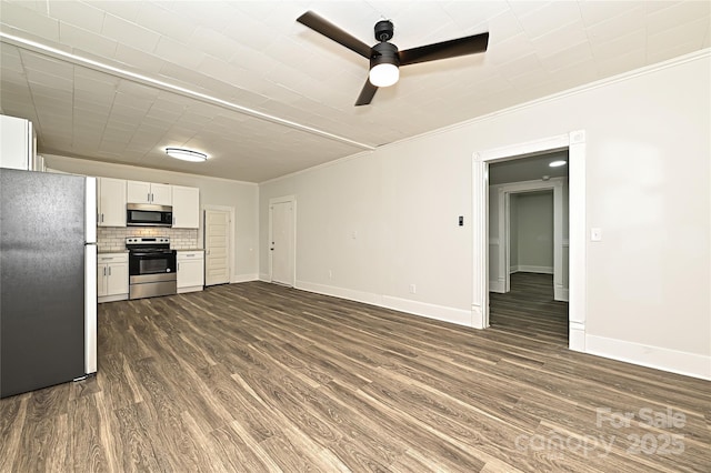 613 E Liberty St, Salisbury, NC 28144 - unfurnished living room featuring ornamental molding, dark wood-type flooring, and ceiling fan