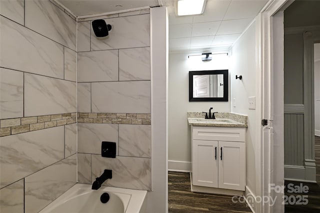 613 E Liberty St, Salisbury, NC 28144 - bathroom featuring vanity, wood finished floors, and shower / bathtub combination