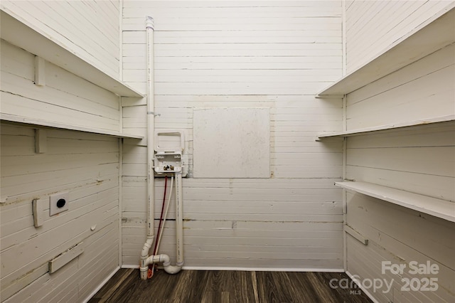 613 E Liberty St, Salisbury, NC 28144 - laundry area featuring electric dryer hookup, dark wood-style floors, and wooden walls