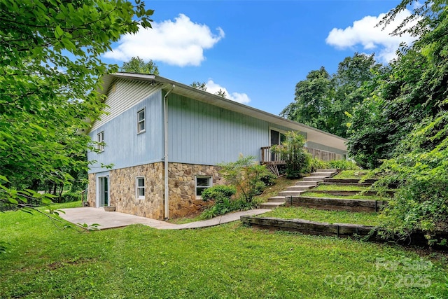 2526 Hankins Rd, Marion, NC 28752 - view of side of property featuring a patio, stone siding, a lawn, and stairway