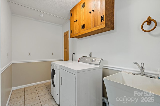 2526 Hankins Rd, Marion, NC 28752 - laundry room with cabinet space, washer and clothes dryer, light tile patterned floors, and a textured ceiling