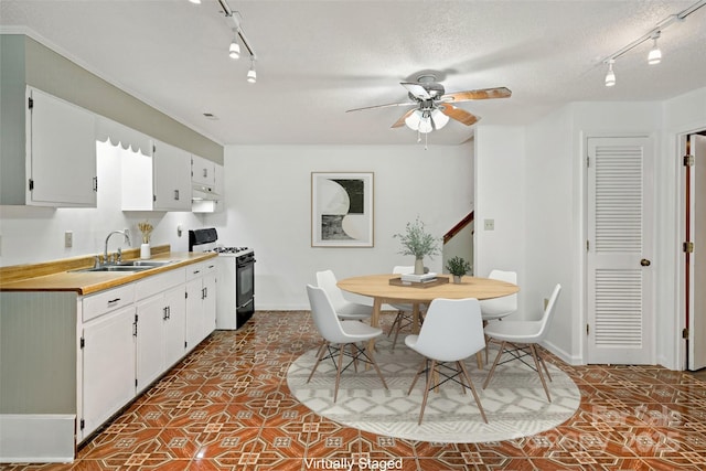 2526 Hankins Rd, Marion, NC 28752 - dining space featuring rail lighting, ceiling fan, a textured ceiling, and tile patterned floors