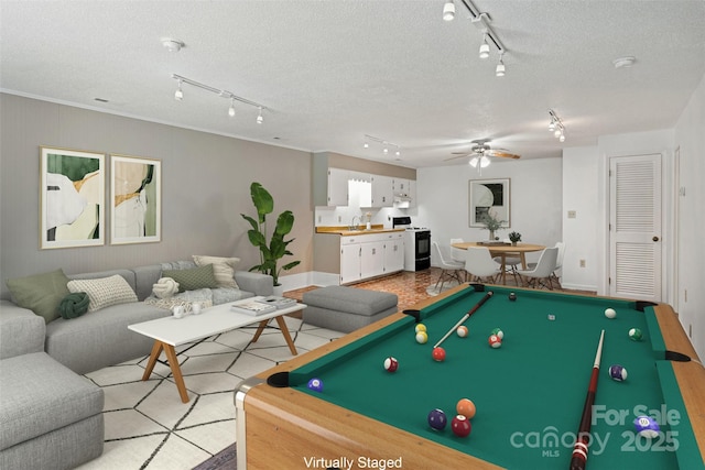 2526 Hankins Rd, Marion, NC 28752 - game room with track lighting, ceiling fan, billiards table, and a textured ceiling