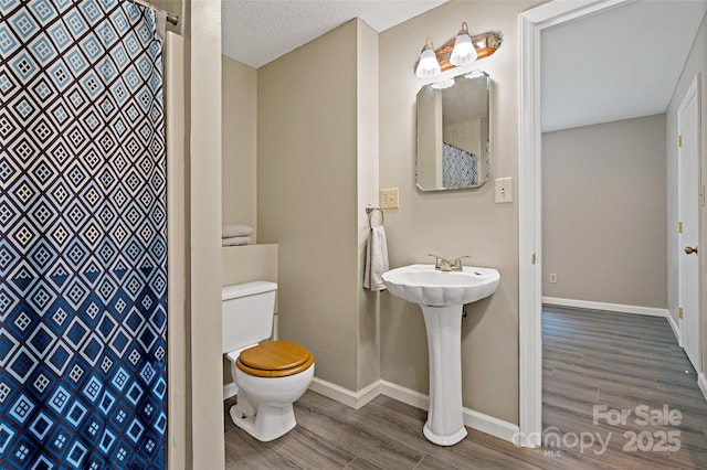 2526 Hankins Rd, Marion, NC 28752 - full bath with wood finished floors and curtained shower