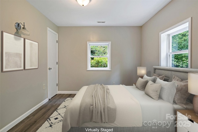 2526 Hankins Rd, Marion, NC 28752 - bedroom featuring multiple windows and dark wood-style flooring