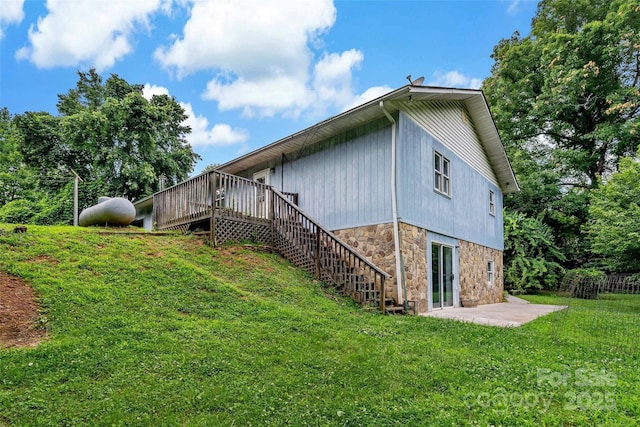 2526 Hankins Rd, Marion, NC 28752 - view of side of property featuring stone siding, a yard, a deck, stairs, and a patio