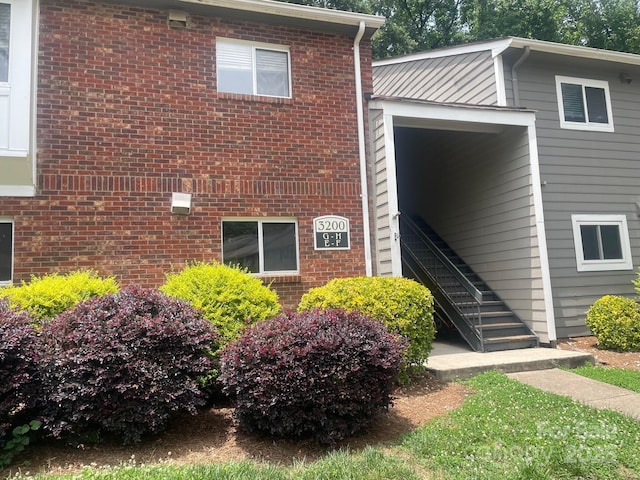 3200 Heathstead Pl Unit E, Charlotte, NC 28210 - view of home's exterior with brick siding and stairs