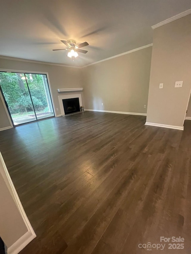 3200 Heathstead Pl Unit E, Charlotte, NC 28210 - unfurnished living room featuring crown molding, ceiling fan, dark wood-type flooring, and a fireplace