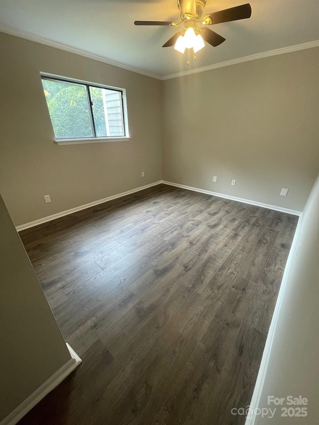 3200 Heathstead Pl Unit E, Charlotte, NC 28210 - spare room featuring ornamental molding, dark wood-type flooring, and a ceiling fan