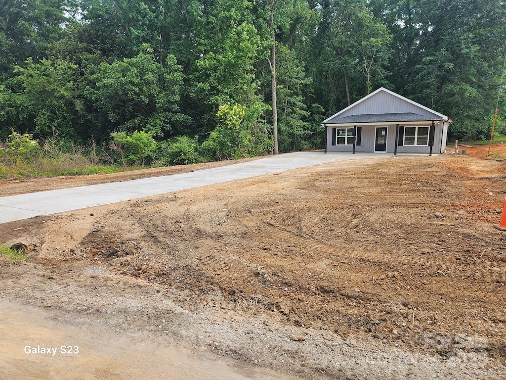 814 Generation Ln, Clover, SC 29710 - view of front of house featuring a forest view and driveway