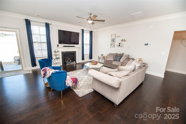 660 Highgarden Ln, Boiling Springs, SC 29316 - living room featuring dark wood-style floors, ornamental molding, ceiling fan, a glass covered fireplace, and plenty of natural light