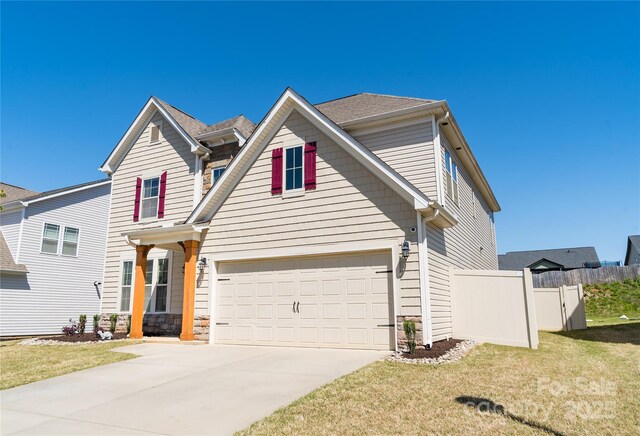 660 Highgarden Ln, Boiling Springs, SC 29316 - traditional-style house with concrete driveway, a garage, and stone siding