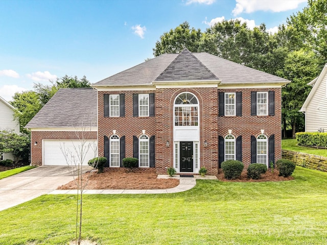 3533 Weddington Ridge Ln, Matthews, NC 28105 - colonial inspired home featuring brick siding, a garage, driveway, and a front lawn