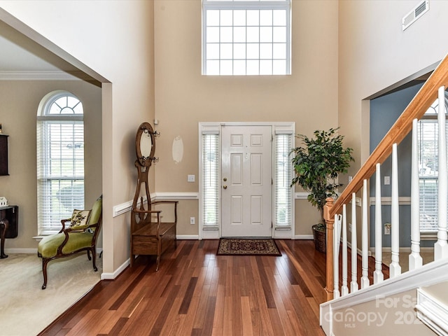 3533 Weddington Ridge Ln, Matthews, NC 28105 - foyer entrance with wood finished floors, stairway, ornamental molding, and a towering ceiling