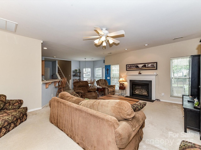 3533 Weddington Ridge Ln, Matthews, NC 28105 - living room with carpet flooring, a ceiling fan, a glass covered fireplace, and recessed lighting