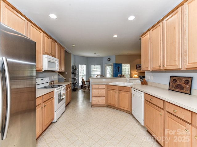 3533 Weddington Ridge Ln, Matthews, NC 28105 - kitchen featuring white appliances, a peninsula, light flooring, light countertops, and recessed lighting
