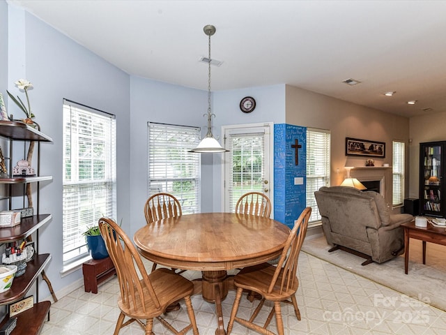 3533 Weddington Ridge Ln, Matthews, NC 28105 - dining space with a fireplace and recessed lighting