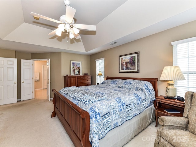 3533 Weddington Ridge Ln, Matthews, NC 28105 - bedroom featuring a tray ceiling, light colored carpet, and a ceiling fan