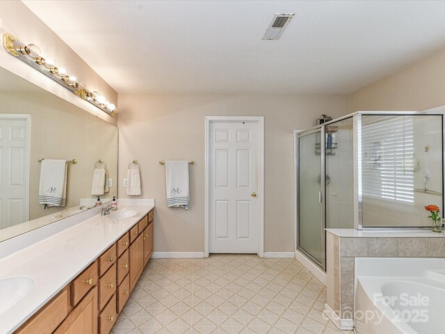 3533 Weddington Ridge Ln, Matthews, NC 28105 - full bath featuring a shower stall, double vanity, a bath, and tile patterned floors