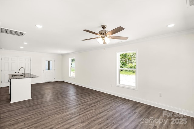 812 Generation Ln, Clover, SC 29710 - unfurnished living room featuring crown molding, plenty of natural light, dark wood-style floors, ceiling fan, and recessed lighting