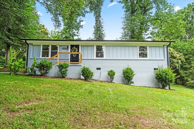 10514 Harbor Dr, Charlotte, NC 28214 - view of front of house featuring brick siding, board and batten siding, and a front lawn