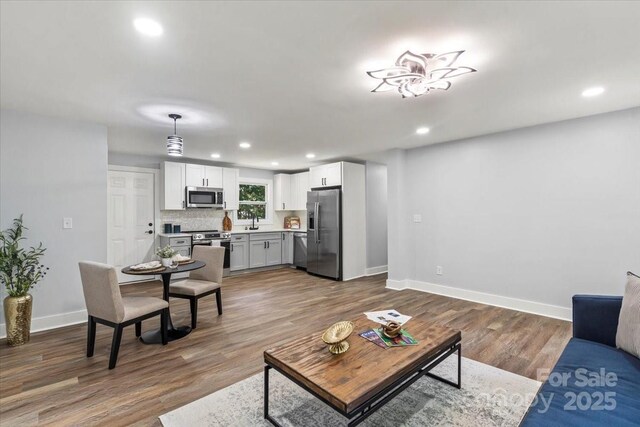10514 Harbor Dr, Charlotte, NC 28214 - living room featuring recessed lighting and wood finished floors