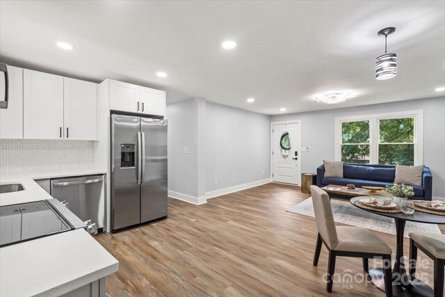 10514 Harbor Dr, Charlotte, NC 28214 - dining area featuring light wood-type flooring and recessed lighting