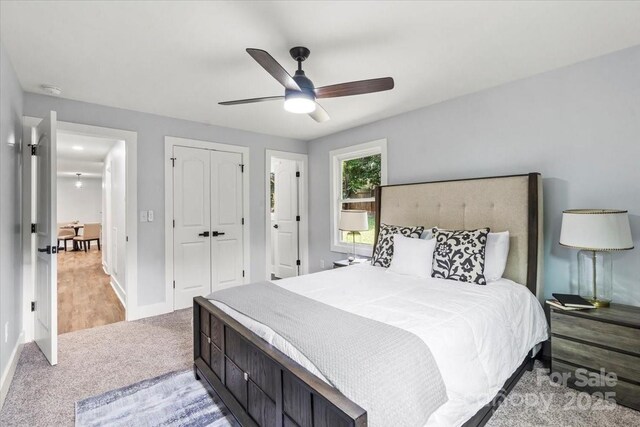 10514 Harbor Dr, Charlotte, NC 28214 - bedroom with light colored carpet, a closet, and ceiling fan