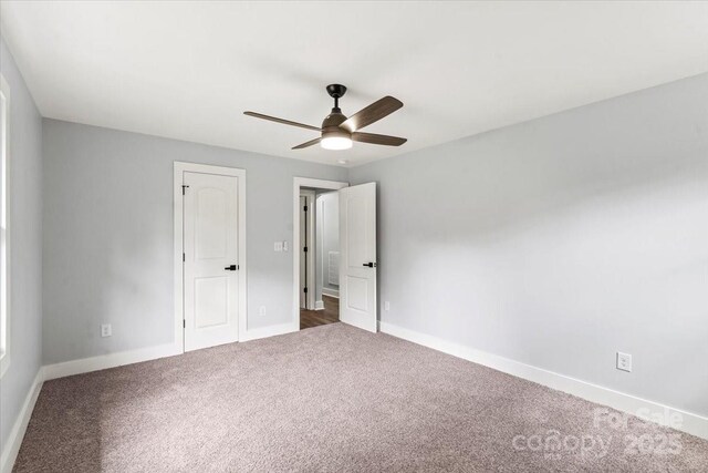 10514 Harbor Dr, Charlotte, NC 28214 - unfurnished bedroom featuring carpet and a ceiling fan