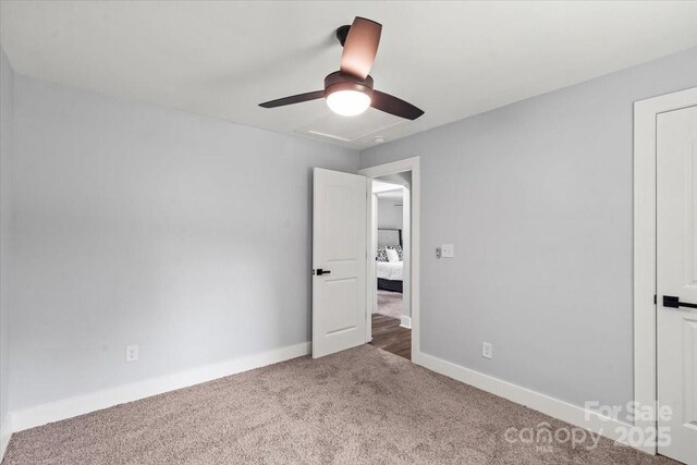 10514 Harbor Dr, Charlotte, NC 28214 - unfurnished bedroom featuring carpet floors and a ceiling fan