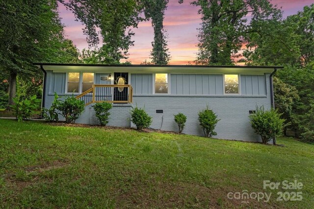10514 Harbor Dr, Charlotte, NC 28214 - ranch-style home featuring brick siding, a lawn, and board and batten siding