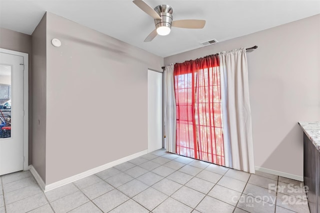 6113 Windsor Gate Ln Unit 6113, Charlotte, NC 28215 - unfurnished room featuring light tile patterned floors, ceiling fan, and a smoke detector