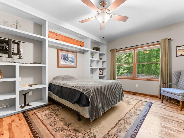 253 Sandy Ln, Brevard, NC 28712 - bedroom with wood finished floors and a ceiling fan