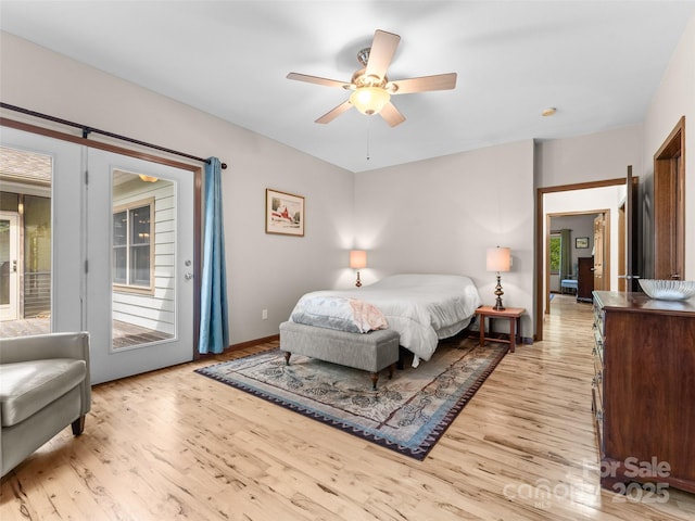 253 Sandy Ln, Brevard, NC 28712 - bedroom with light wood-style flooring, access to exterior, and a ceiling fan