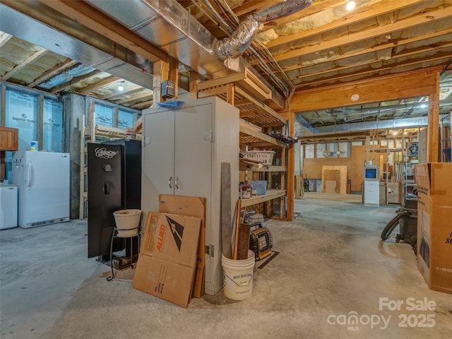 253 Sandy Ln, Brevard, NC 28712 - unfinished below grade area featuring freestanding refrigerator