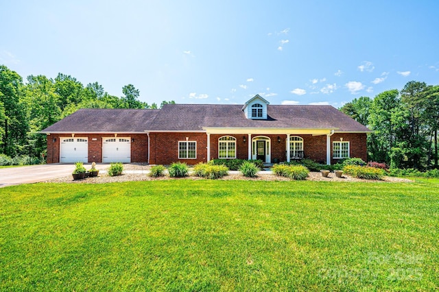 4010 Carlton Dr, Claremont, NC 28610 - view of front of home with a front lawn, concrete driveway, an attached garage, brick siding, and covered porch