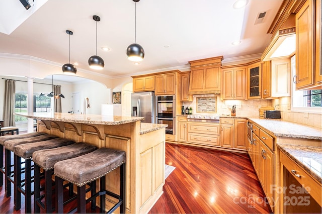 4010 Carlton Dr, Claremont, NC 28610 - kitchen with appliances with stainless steel finishes, dark wood-type flooring, a breakfast bar area, crown molding, and glass insert cabinets