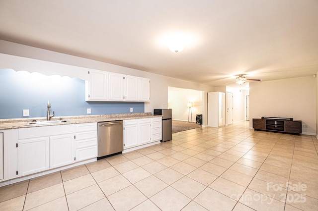 4010 Carlton Dr, Claremont, NC 28610 - kitchen featuring appliances with stainless steel finishes, a ceiling fan, white cabinets, and open floor plan
