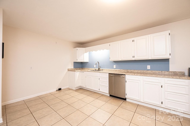 4010 Carlton Dr, Claremont, NC 28610 - kitchen with stainless steel dishwasher, white cabinetry, light tile patterned floors, and light stone countertops