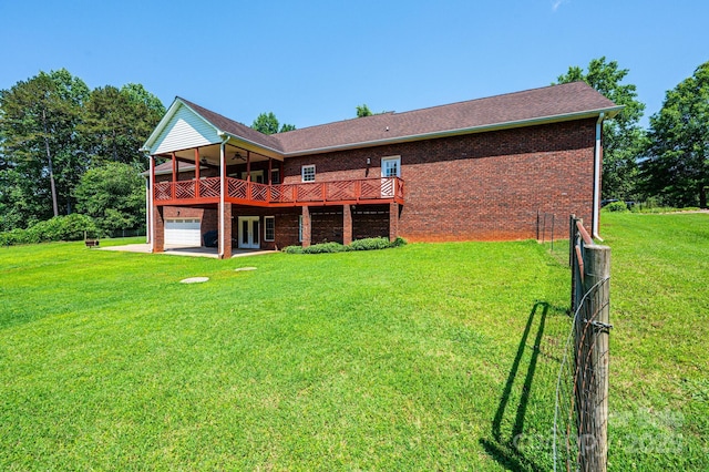 4010 Carlton Dr, Claremont, NC 28610 - rear view of house featuring a lawn, brick siding, a wooden deck, and ceiling fan