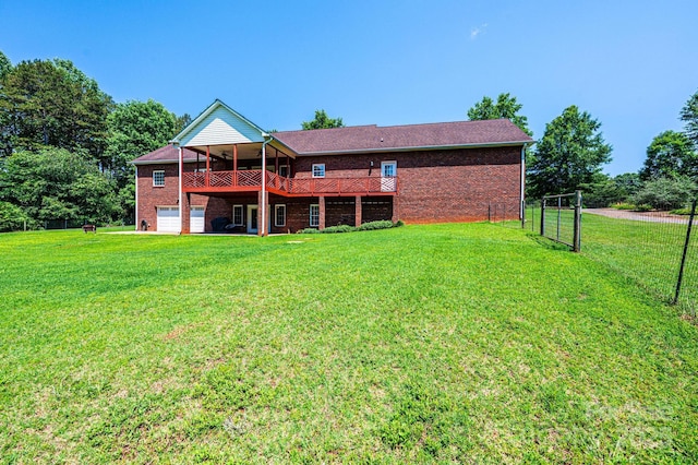 4010 Carlton Dr, Claremont, NC 28610 - back of house featuring a wooden deck, brick siding, and an attached garage