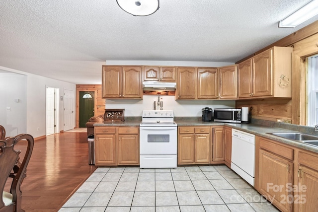 66 Ashlyn Ln, Tryon, NC 28782 - kitchen featuring white appliances, under cabinet range hood, a textured ceiling, and dark countertops
