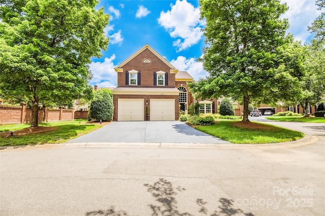 10418 Pullengreen Dr, Charlotte, NC 28277 - traditional home with brick siding, an attached garage, and concrete driveway