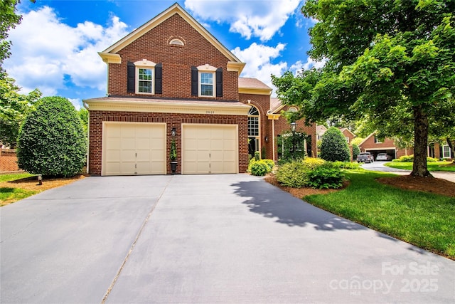 10418 Pullengreen Dr, Charlotte, NC 28277 - traditional-style home with driveway, a garage, and brick siding