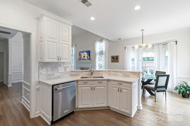 10418 Pullengreen Dr, Charlotte, NC 28277 - kitchen featuring stainless steel dishwasher, backsplash, wood finished floors, a chandelier, and recessed lighting