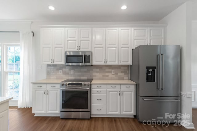 10418 Pullengreen Dr, Charlotte, NC 28277 - kitchen featuring stainless steel appliances, dark wood finished floors, light countertops, backsplash, and recessed lighting