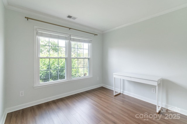 10418 Pullengreen Dr, Charlotte, NC 28277 - spare room featuring ornamental molding and wood finished floors